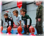 Mass Premier Children Learning how to Kick Footballs